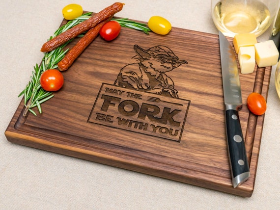 Star Wars laser-engraved onto a walnut cutting board is the kind of nerdy kitchen flex that gets pulled out every time guests come over.