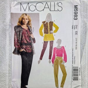 May include: A McCall's M5983 sewing pattern envelope for sizes EE 14-16-18-20. The front displays illustrations and a photograph of garments including a faux fur vest, a long-sleeved blouse with a paisley print, a yellow tunic, and trousers.