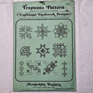 May include: A light green paper pattern sheet titled Trapunto Pattern Traditional Patchwork Designs by Pat George. The sheet features black line drawings of various geometric star, square, and linear quilt block motifs, with Newstalgia Designs text at the bottom.
