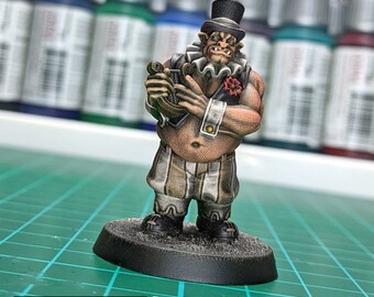 May include: A hand-painted miniature figurine of a goblin wearing a top hat and clown costume, holding a musical instrument. The figurine is standing on a black base.  ALL MODELS COME UNPAINTED ALL MODELS COME WITH A ROUND BASE HIGH QUALITY, EXCLUSIVE RESIN MIXTURE USUALLY DISPATCH WITHIN 48H