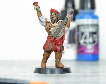 May include: A miniature figurine of a bard playing a lute, wearing a red and brown costume, holding a rose in one hand. The figurine is standing on a black base.