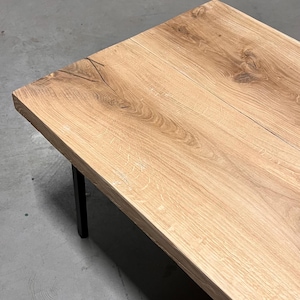 Solid oak wood coffee table on thin straight designer legs