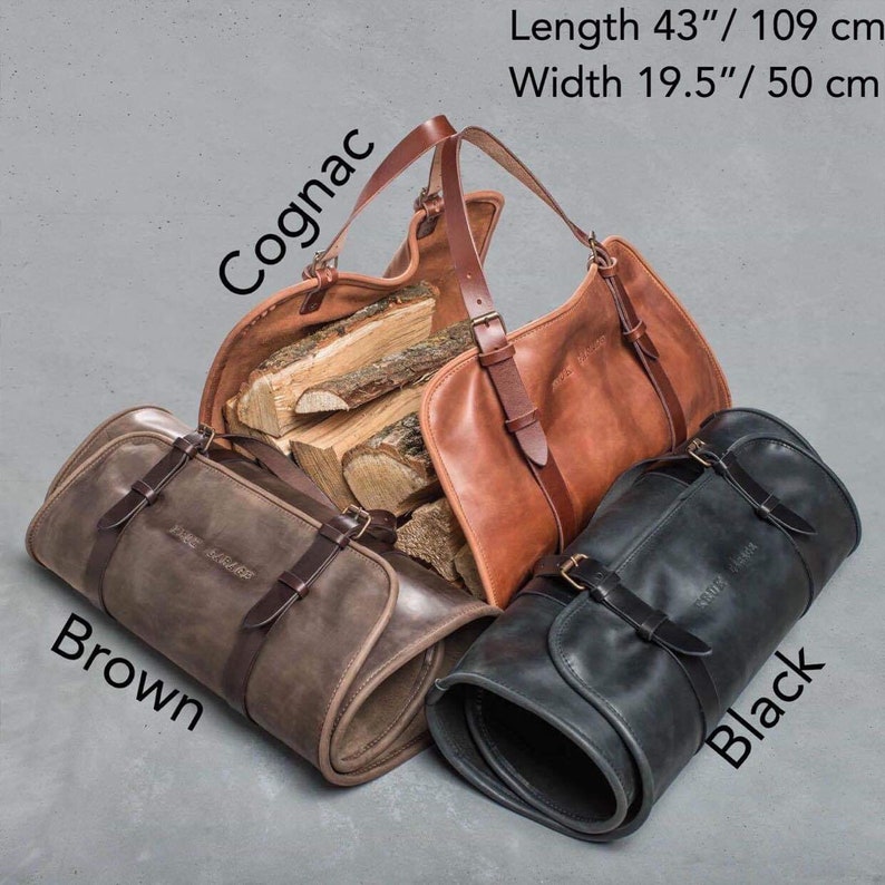 May include: Three leather bags in cognac, brown, and black. The cognac bag is open and filled with firewood. The brown and black bags are rolled up. The bags are labeled with their colors and have the text "The Beluga" on them. The bags measure 43 inches in length and 19.5 inches in width.