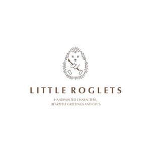 May include: A logo for a business called "Little Roglets" featuring a hand-drawn illustration of a hedgehog holding a paintbrush. The text below the image reads "Handpainted characters, heartfelt greetings and gifts."
