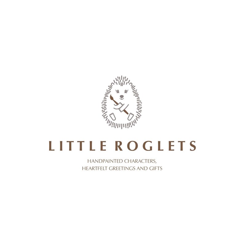 May include: A logo for a business called "Little Roglets" featuring a hand-drawn illustration of a hedgehog holding a paintbrush. The text below the image reads "Handpainted characters, heartfelt greetings and gifts."