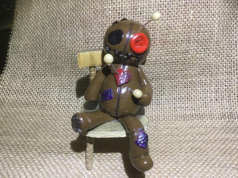 clay voodoo doll