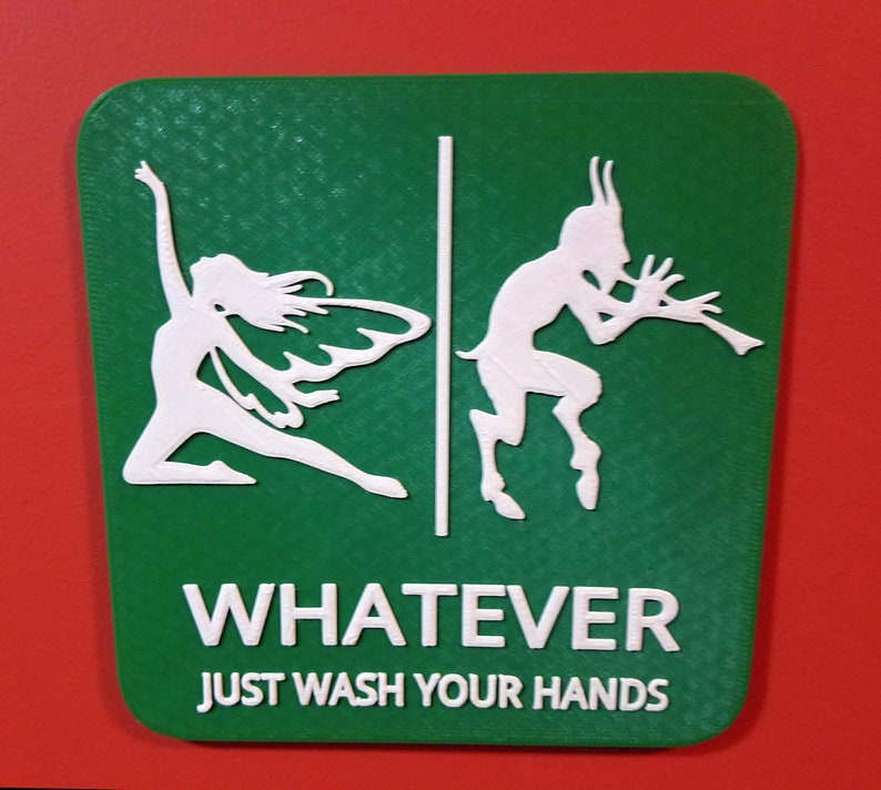 May include: Green sign with a white fairy and a white goat playing a flute. The sign says "WHATEVER JUST WASH YOUR HANDS".