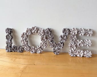 Wood LOVE sign with handmade flowers