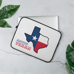May include: White laptop sleeve with a black outline of the state of Texas, featuring the Texas flag colors of blue, white, and red. The text "NATIVE TEXAN" is printed in red and blue letters.