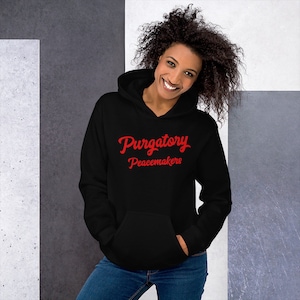 May include: Black hooded sweatshirt with red text that reads "Purgatory Peacemakers".