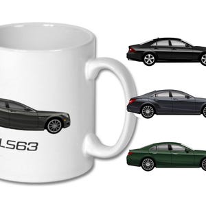 May include: White ceramic mug with a dark grey car and the text "CLS63". Three car illustrations in black, grey, and green are also shown. The mug has a curved handle.