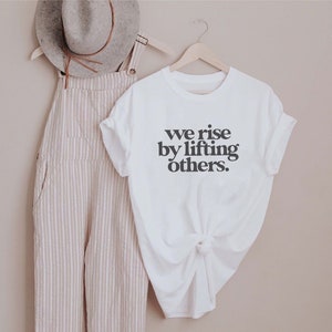 We rise by lifting others shirt