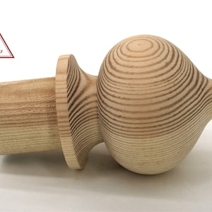 May include: A wooden finial with a rounded, bulbous top and a cylindrical base. The finial is made of light-colored wood with a natural grain pattern.