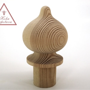 May include: A wooden finial with a rounded top and a base. The finial is made of natural wood with a light brown color.