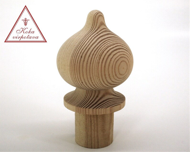 May include: A wooden finial with a rounded top and a base. The finial is made of natural wood with a light brown color.