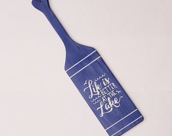 Life is Better at the Lake Wood Paddle Oar Painted Sign with White Lettering Birds Water and Stripes Vertical with Hanging Strap