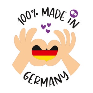 May include: Two hands forming a heart shape with the German flag inside. The text "100% MADE IN GERMANY" is written around the hands. There are three purple hearts above the hands.