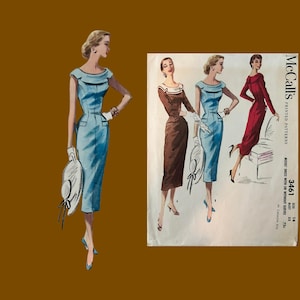 May include: A vintage McCall's 3461 sewing pattern envelope featuring illustrations of a slim-fitting dress with a boat neckline, available in long or short sleeve options. The pattern shows three variations in brown and blue, with text including the brand name, pattern number 3461, size 14, and bust 34.