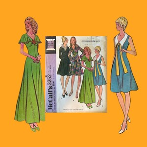 May include: A vintage McCall's 3252 sewing pattern envelope featuring illustrations of four dress styles, including a long green dress and a blue dress with a white collar. The pattern is labeled for misses and junior dresses, recommended for knits.