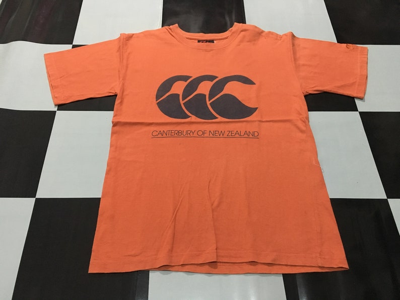 Vintage Canterbury Of New Zealand shirt big logo spell out Orange Size S fits like M