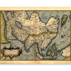 May include: An antique map of Asia from the 16th century, showing the continents of Asia and Europe. The map is printed on aged paper with a light brown background and features a decorative border with a title that reads "Asie Nova Descriptio".