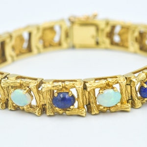 Pulsera vintage de diseñador La Triomphe en oro amarillo de 18 quilates con bambú, lapislázuli y ópalo alternado, eslabones cuadrados y cabujones ovalados.