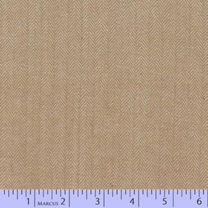 May include: Close-up of tan herringbone fabric. The fabric has a repeating V-shaped pattern. A ruler with inch measurements is at the bottom of the image. The fabric is a neutral colour and could be used for various sewing projects.