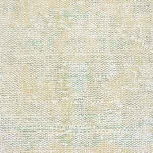 May include: Close-up of a beige woven fabric with a subtle green pattern. The fabric has a textured, slightly rough surface.