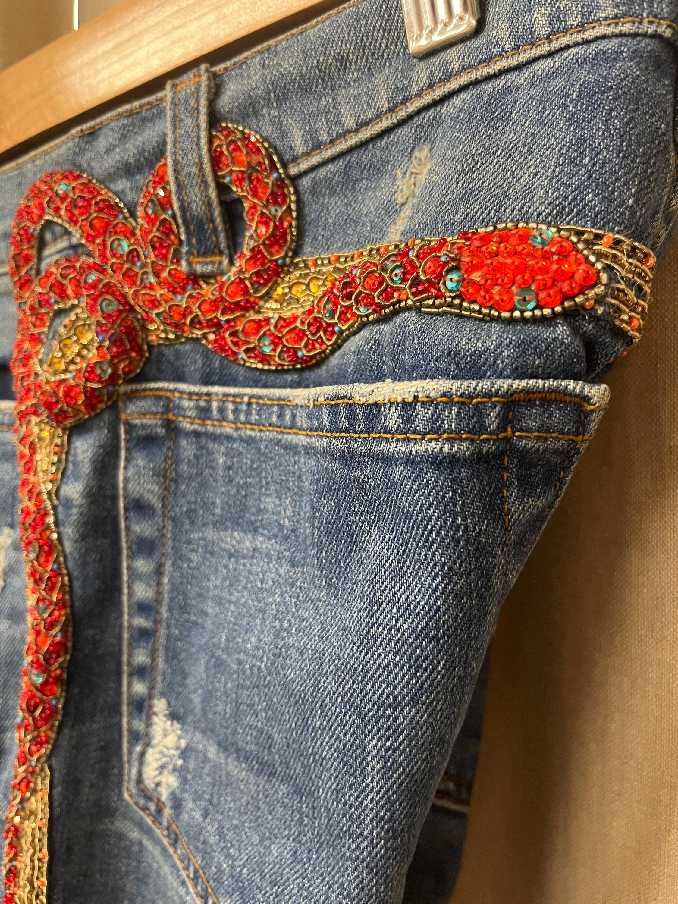 Snake embroidered jeans deals