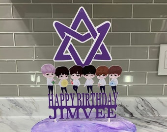 May include: Purple and white marbled cake with a purple and white cake topper featuring a cartoon group of men and the text "Happy Birthday Jimvee".