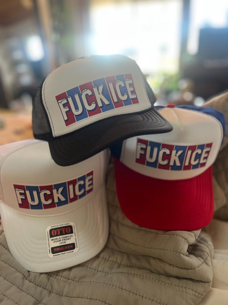 May include: Three trucker hats with the text "FUCK ICE" in red, white, and blue block letters. One hat is black, one is white with a red brim, and one is white with a black mesh back.