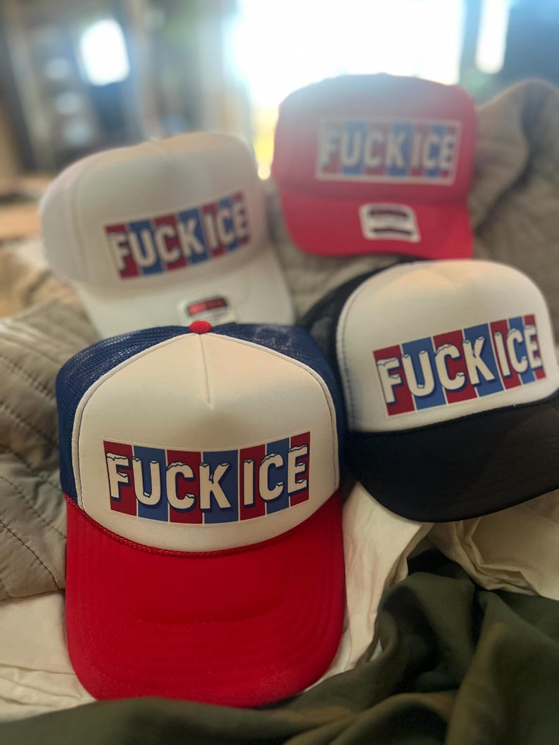 May include: Four baseball caps with the text "FUCK ICE" in red, white, and blue block letters. The caps are white, red, black, and blue. The caps have a mesh back and a curved brim.