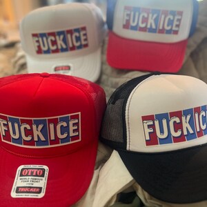 May include: Four trucker hats with the text "FUCK ICE" in red, white, and blue. The hats have different color schemes: white with red and blue, red with blue, red with black, and black with white.