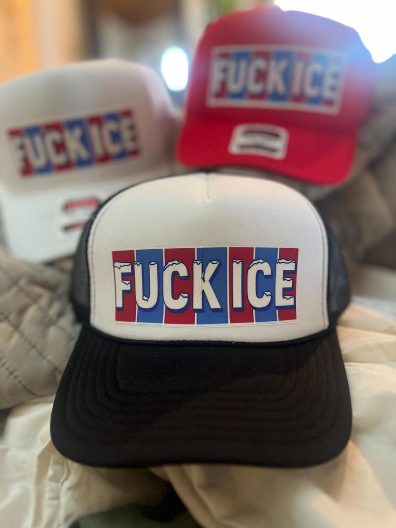 May include: Three trucker hats with the text "FUCK ICE" in red, white, and blue block letters. The hats are white, red, and black with a mesh back.