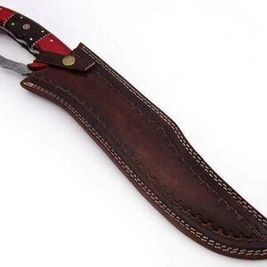 May include: A brown leather sheath with a decorative stitch pattern and a red and black handle knife.