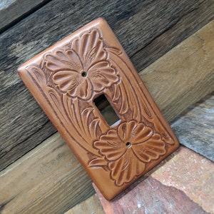 Switch plate cover made on leather and tooled floral pattern