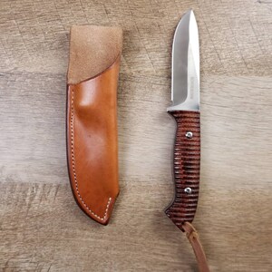 Rough rider hunting knife with a plain straight hang leather sheath
