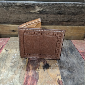 Handmade leather bifold wallet rough out with border design