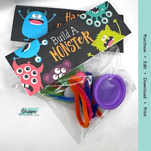 May include: A printable party favor bag with a black and white monster design. The bag includes the text "Build A Monster". The bag is filled with colorful pipe cleaners and a purple playdough container.