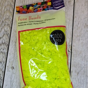 May include: A bag of 1100 neon yellow fuse beads. The bag is labeled "Fuse Beads" and has the brand name "vaesser creative" printed on it.