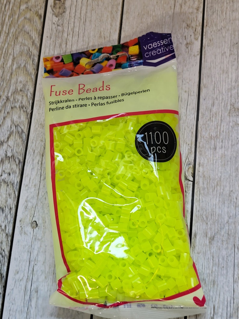 May include: A bag of 1100 neon yellow fuse beads. The bag is labeled "Fuse Beads" and has the brand name "vaesser creative" printed on it.