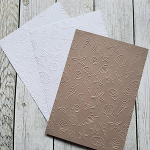 Geprägtes Bastelpapier Muscheln Strand