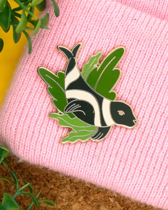 Ribbon seal enamel pin. Endangered animal jacket lapel pin.
