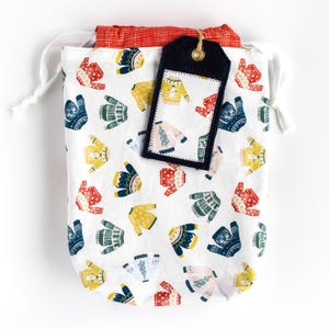 Colorful Winter Sweaters + Solid Navy Reversible Fabric Gift Bag and Reusable Gift Tag Set | Finney & Roo Sustainable Wrapping
