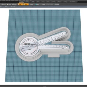 May include: A white plastic protractor with a circular scale labelled "BASELINE" and a red arrow pointing to 15 degrees. The protractor has two rulers, one on each side, with markings in inches and centimetres.