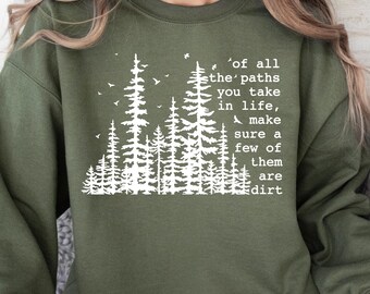 May include: A green sweatshirt with a white graphic print of a forest with the text 'of all the paths you take in life, make sure a few of them are dirt'.