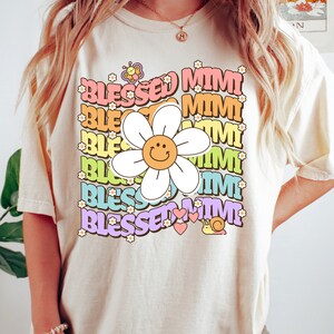 a woman wearing a t - shirt with a flower on it