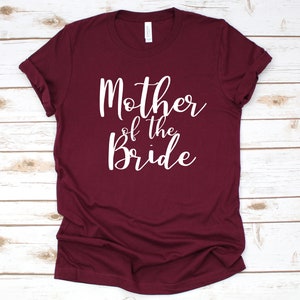 a t - shirt that says mother of the bride on it