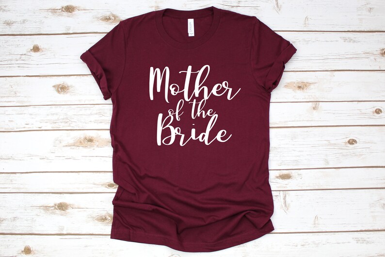 a t - shirt that says mother of the bride on it