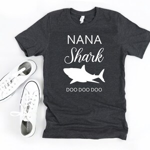 a t - shirt that says nana shark and a pair of sneakers